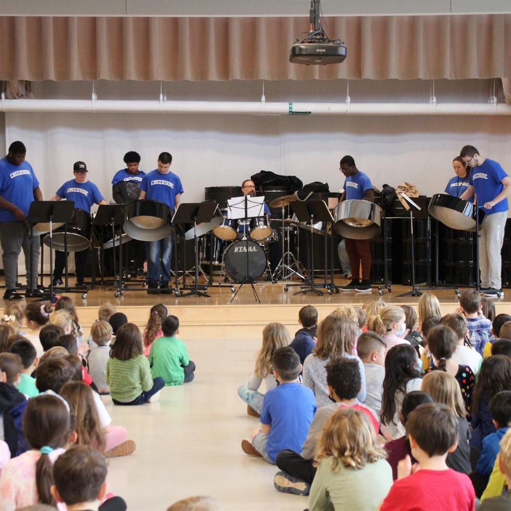  The Creekside Steel Drum Band on stage performing at Council Rock Primary School in Brighton